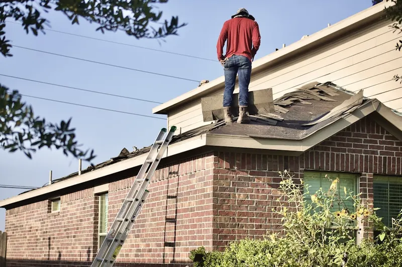 Professional roofer working on a residential roof in Los Altos Hills